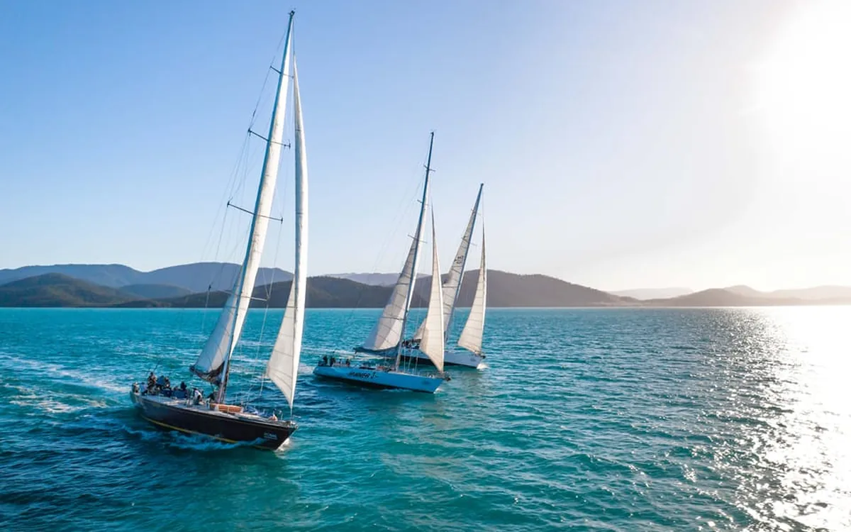 Three maxi yachts sailing together in the Whitsundays